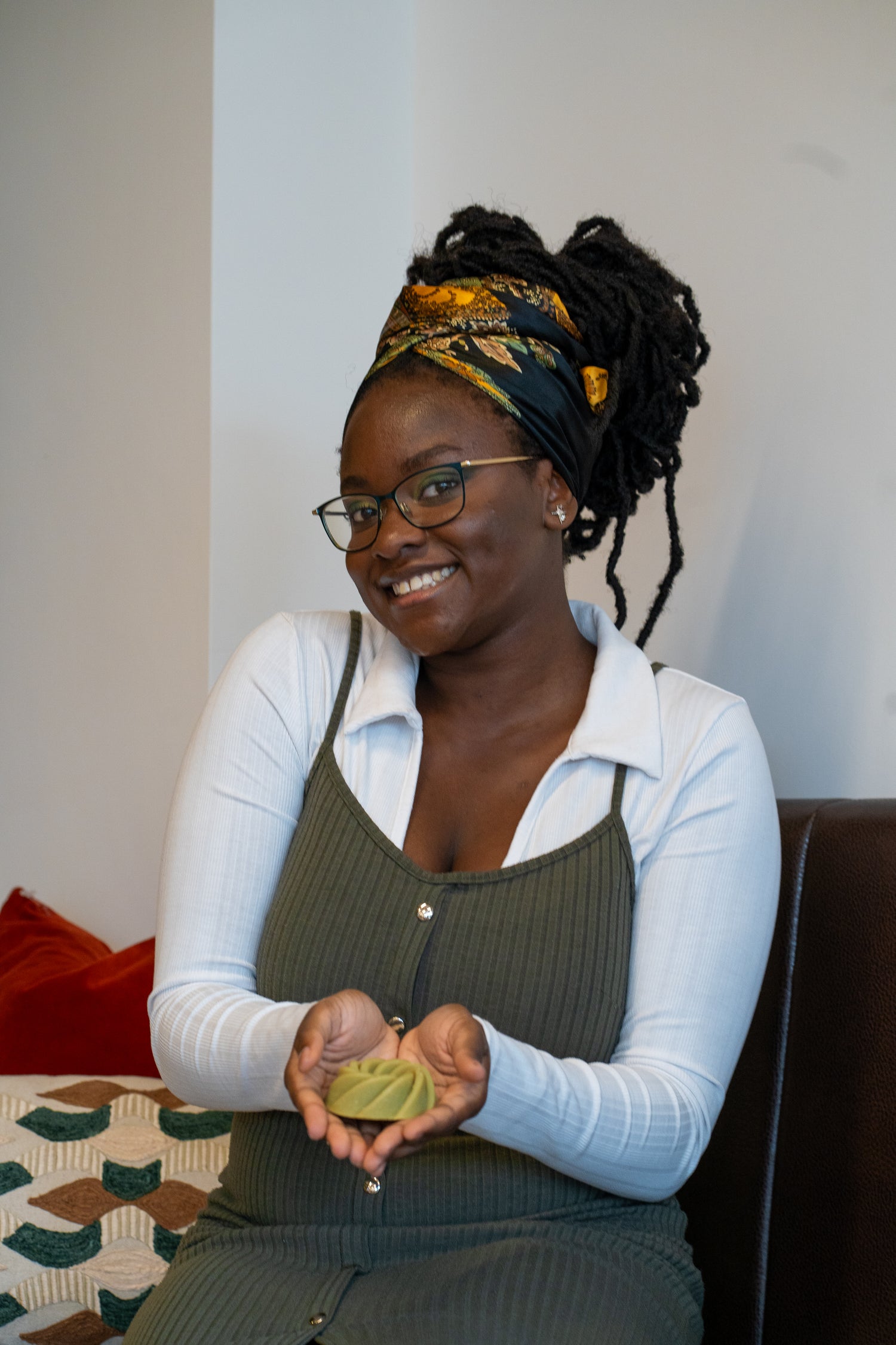 Founder holding moringa & sea moss soap bar